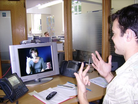man interacting in a video chat